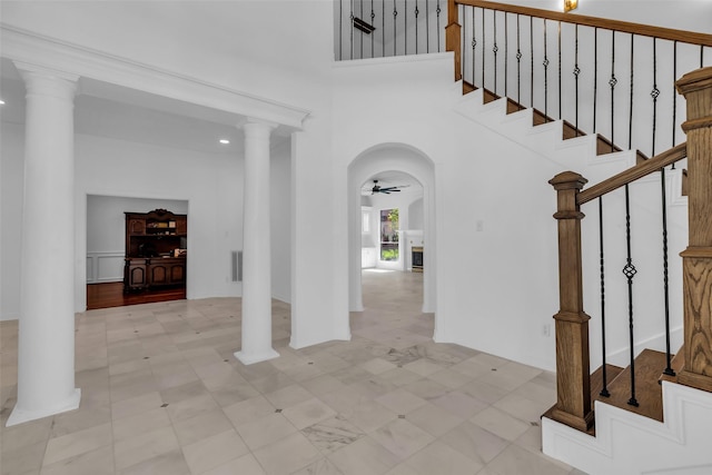24 Stonegate Park Ct, Spring, TX 77379 - foyer entrance with stairs, ceiling fan, a towering ceiling, and tile patterned floors