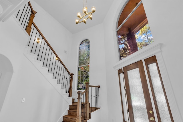 24 Stonegate Park Ct, Spring, TX 77379 - foyer entrance with a high ceiling, a chandelier, and stairs