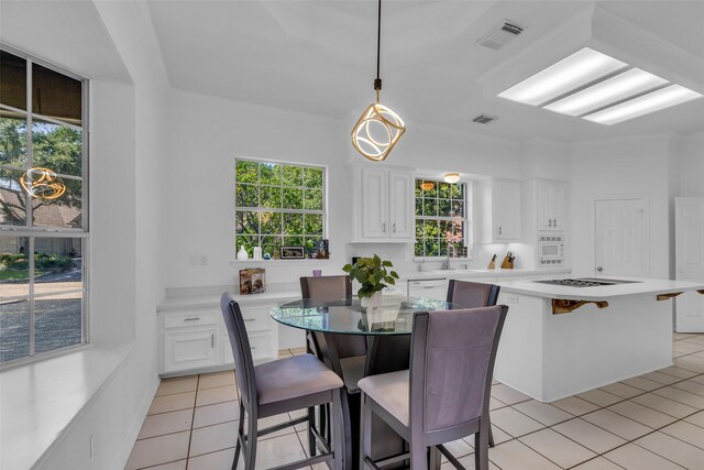 24 Stonegate Park Ct, Spring, TX 77379 - dining room with light tile patterned floors and healthy amount of natural light