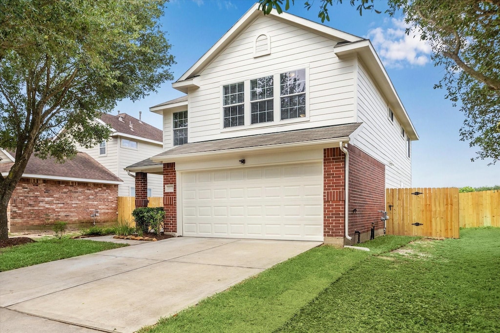 12842 Colony Heath Ln, Houston, TX 77085 - traditional home with brick siding, a garage, concrete driveway, and a gate