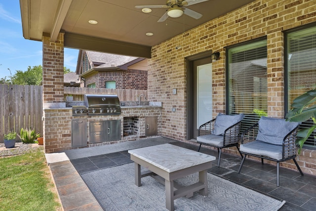 6706 Miller Shadow Ln, Sugar Land, TX 77479 - view of patio with exterior kitchen, fence, grilling area, and ceiling fan