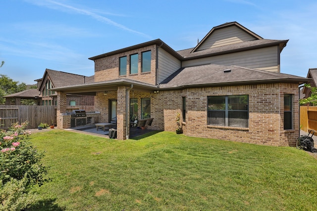 6706 Miller Shadow Ln, Sugar Land, TX 77479 - back of house with exterior kitchen, a patio, brick siding, and roof with shingles