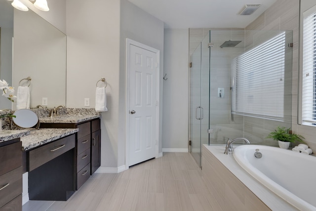 6706 Miller Shadow Ln, Sugar Land, TX 77479 - full bathroom featuring plenty of natural light, vanity, a bath, and a stall shower