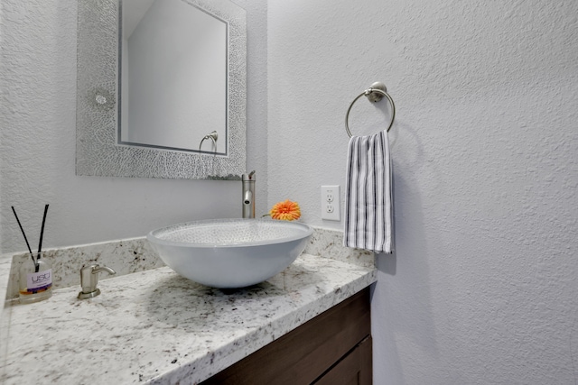 6706 Miller Shadow Ln, Sugar Land, TX 77479 - bathroom featuring a textured wall and vanity