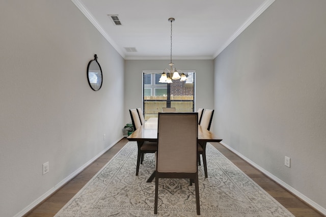 6706 Miller Shadow Ln, Sugar Land, TX 77479 - dining space with a chandelier, wood finished floors, baseboards, and ornamental molding