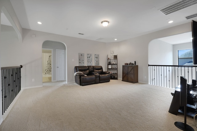6706 Miller Shadow Ln, Sugar Land, TX 77479 - sitting room featuring carpet flooring, arched walkways, recessed lighting, and baseboards