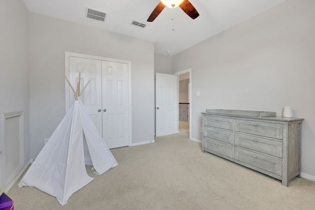 6706 Miller Shadow Ln, Sugar Land, TX 77479 - bedroom with light carpet, baseboards, a closet, and ceiling fan