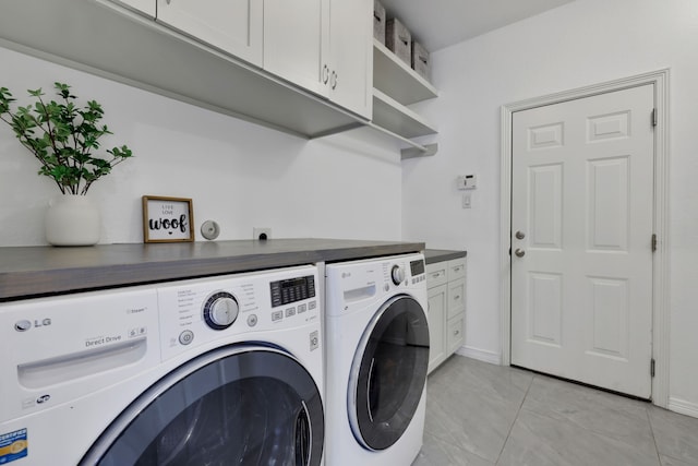 6706 Miller Shadow Ln, Sugar Land, TX 77479 - laundry area with washing machine and dryer, cabinet space, light tile patterned floors, and baseboards