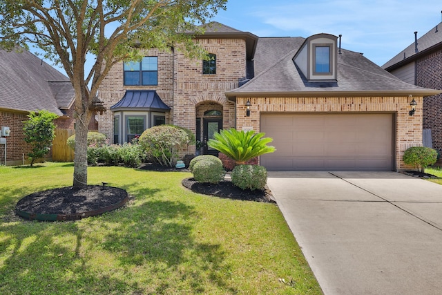 6706 Miller Shadow Ln, Sugar Land, TX 77479 - view of front of home with brick siding, concrete driveway, an attached garage, and roof with shingles