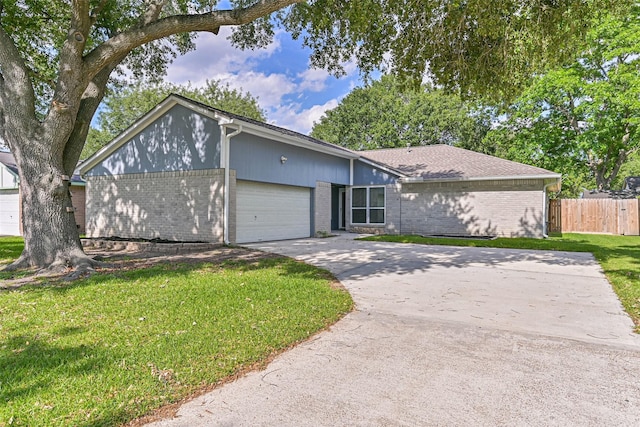 3915 Rosemont Dr, La Porte, TX 77571 - mid-century inspired home featuring brick siding, an attached garage, and driveway