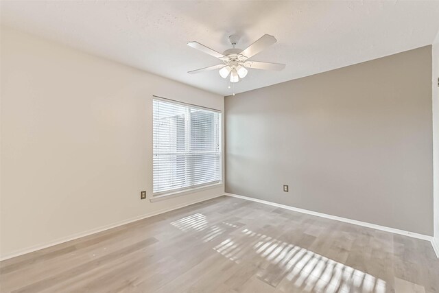 3915 Rosemont Dr, La Porte, TX 77571 - unfurnished room with ceiling fan, light wood-style floors, and baseboards