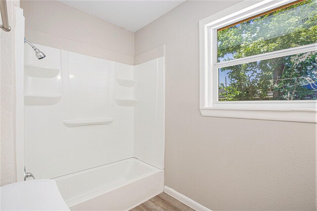 7306 Lakewood Dr, Houston, TX 77016 - full bathroom with baseboards, bathtub / shower combination, and wood finished floors
