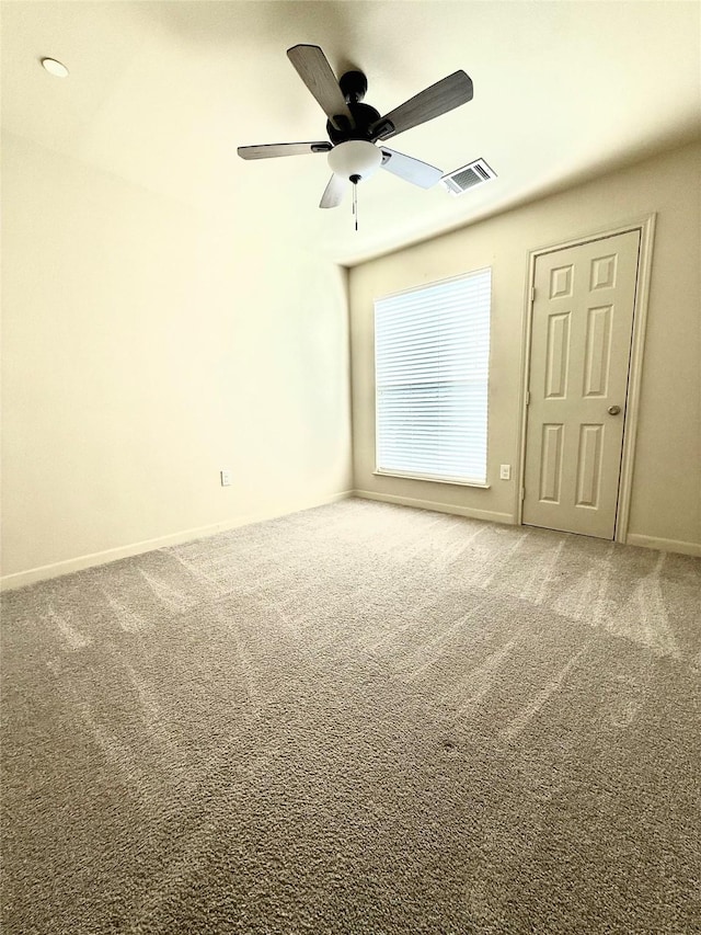 7600 Emmett F Lowry Expy Unit 409, Texas City, TX 77591 - empty room featuring carpet floors, a ceiling fan, and baseboards