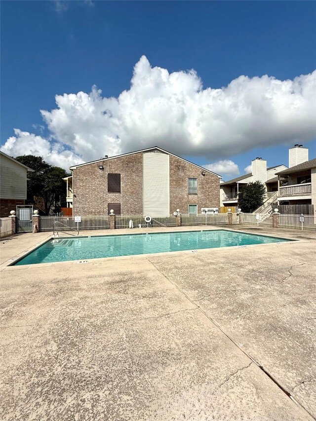 7600 Emmett F Lowry Expy Unit 409, Texas City, TX 77591 - community pool with fence and a patio