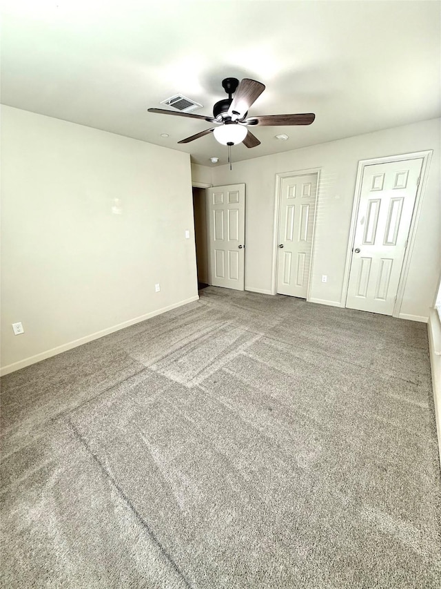 7600 Emmett F Lowry Expy Unit 409, Texas City, TX 77591 - unfurnished bedroom featuring baseboards, carpet floors, and ceiling fan