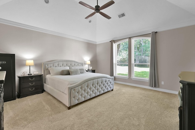 bedroom featuring carpet, vaulted ceiling, crown molding, a ceiling fan, and baseboards