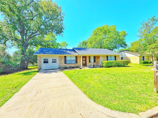 803 Wolley Cir, Crockett, TX 75835 - single story home with concrete driveway, a front lawn, and brick siding