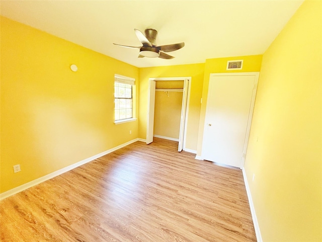 803 Wolley Cir, Crockett, TX 75835 - unfurnished bedroom with a closet, light wood-style flooring, baseboards, and a ceiling fan