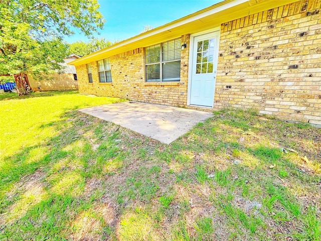 803 Wolley Cir, Crockett, TX 75835 - view of green lawn featuring a patio