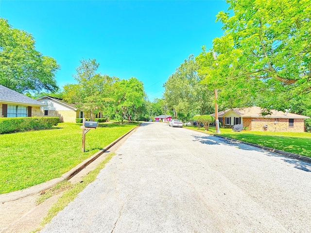 803 Wolley Cir, Crockett, TX 75835 - view of asphalt street featuring curbs