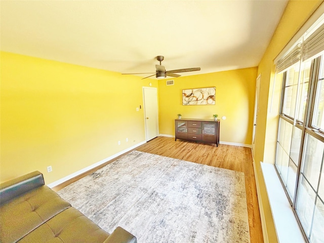 803 Wolley Cir, Crockett, TX 75835 - living room with wood finished floors, ceiling fan, and baseboards