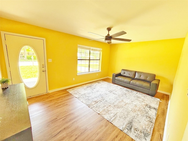 803 Wolley Cir, Crockett, TX 75835 - living area with plenty of natural light, a ceiling fan, light wood-style flooring, and baseboards
