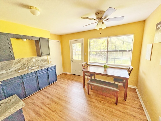 803 Wolley Cir, Crockett, TX 75835 - dining space with baseboards, a ceiling fan, and light wood-type flooring