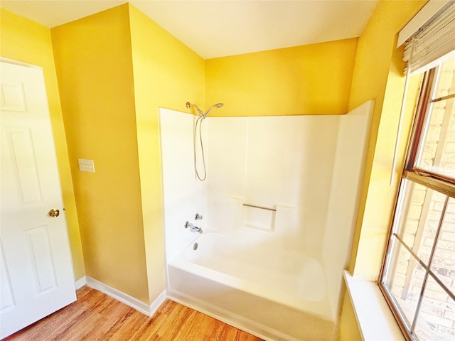 803 Wolley Cir, Crockett, TX 75835 - full bath featuring wood finished floors, baseboards, and tub / shower combination