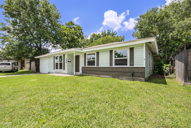2705 Camille St, Pasadena, TX 77506 - view of front of home featuring an attached garage and a front lawn
