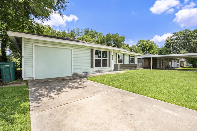 2705 Camille St, Pasadena, TX 77506 - view of front facade with a front lawn, driveway, and a garage