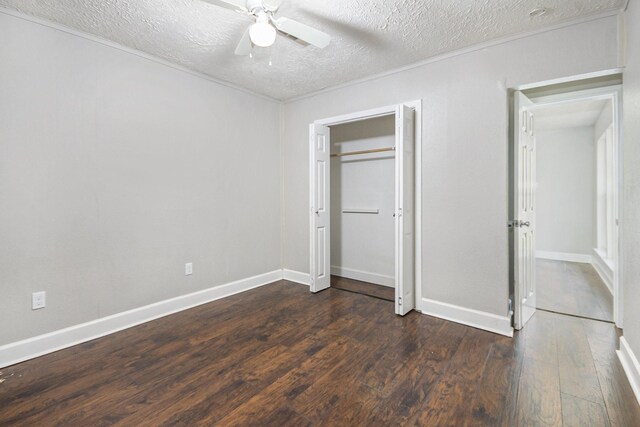 2705 Camille St, Pasadena, TX 77506 - unfurnished bedroom featuring dark wood finished floors, a textured ceiling, a ceiling fan, and baseboards