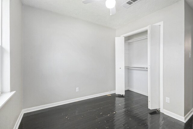 2705 Camille St, Pasadena, TX 77506 - unfurnished bedroom with baseboards, wood finished floors, a textured ceiling, a ceiling fan, and a closet