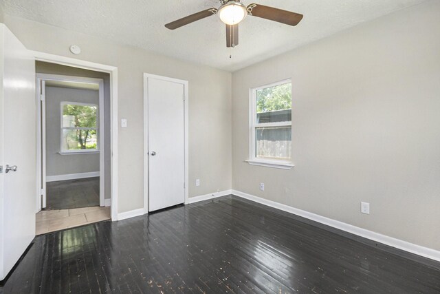 2705 Camille St, Pasadena, TX 77506 - unfurnished bedroom with hardwood / wood-style flooring, baseboards, ceiling fan, and a textured ceiling
