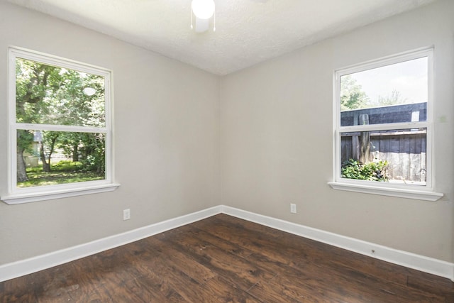 2705 Camille St, Pasadena, TX 77506 - spare room featuring baseboards and dark wood-style flooring