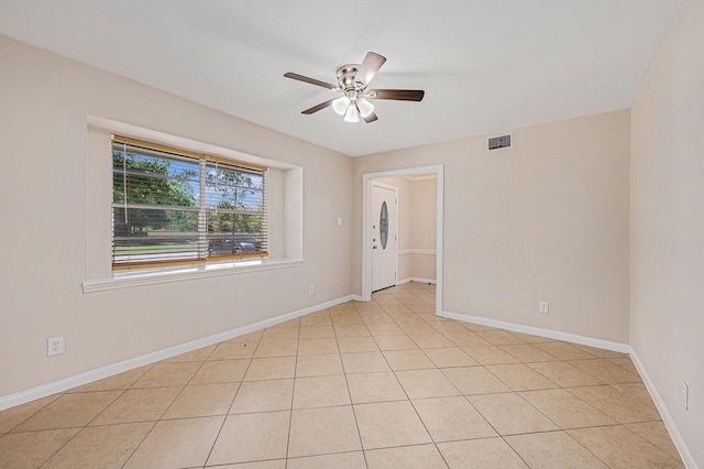 6046 W Airport Blvd, Houston, TX 77035 - spare room featuring ceiling fan, baseboards, and light tile patterned floors