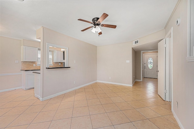 6046 W Airport Blvd, Houston, TX 77035 - empty room featuring a ceiling fan, light tile patterned floors, and baseboards