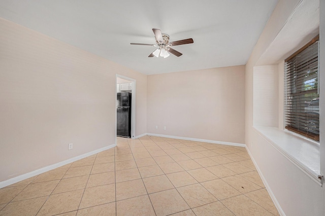 6046 W Airport Blvd, Houston, TX 77035 - spare room featuring a ceiling fan, baseboards, and light tile patterned floors