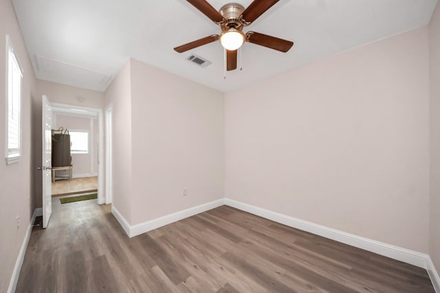 129 E 6th St, Deer Park, TX 77536 - spare room with wood finished floors and baseboards