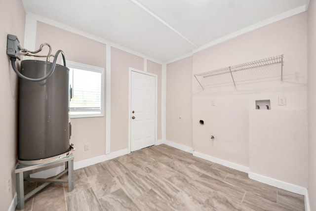 129 E 6th St, Deer Park, TX 77536 - clothes washing area featuring hookup for a washing machine, water heater, and baseboards