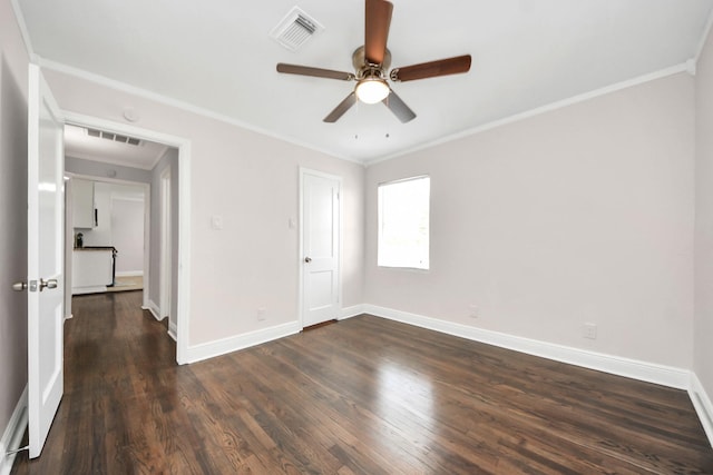 129 E 6th St, Deer Park, TX 77536 - unfurnished bedroom featuring ornamental molding, dark wood finished floors, baseboards, and a ceiling fan