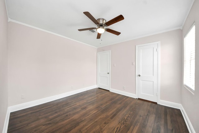 129 E 6th St, Deer Park, TX 77536 - unfurnished bedroom featuring dark wood-style floors, baseboards, crown molding, and a ceiling fan