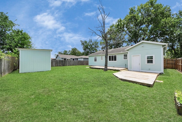 129 E 6th St, Deer Park, TX 77536 - view of yard with an outbuilding, a storage unit, and a wooden deck