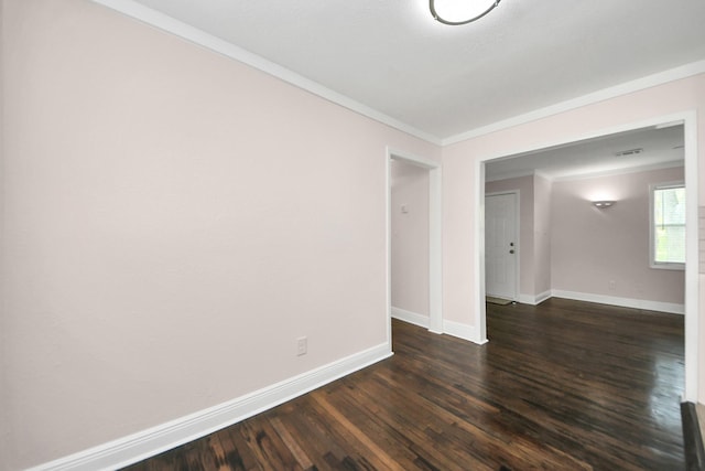 129 E 6th St, Deer Park, TX 77536 - empty room featuring ornamental molding, baseboards, and dark wood-type flooring