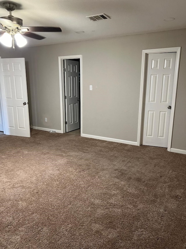 1506 Grand Valley Dr, Houston, TX 77090 - spare room featuring dark carpet, ceiling fan, and baseboards