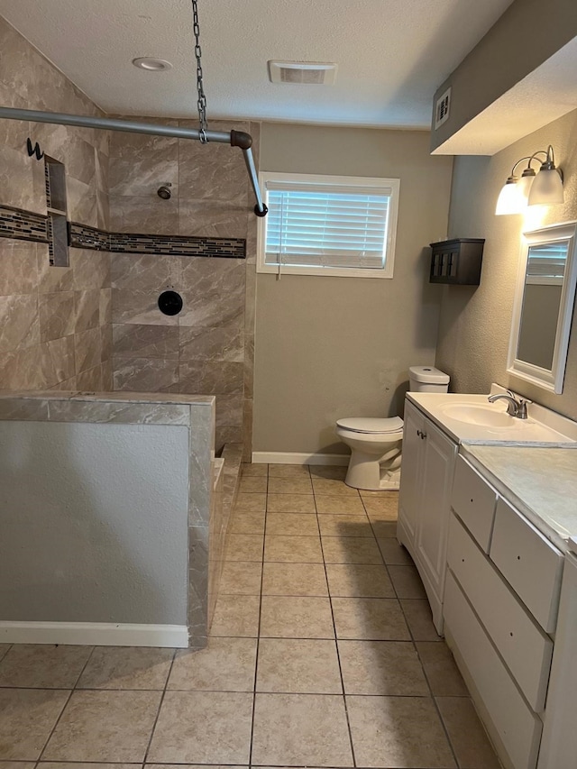1506 Grand Valley Dr, Houston, TX 77090 - full bath featuring tiled shower, vanity, toilet, tile patterned flooring, and a textured ceiling