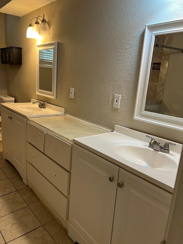 1506 Grand Valley Dr, Houston, TX 77090 - full bathroom featuring tile patterned floors, a shower, double vanity, and a textured wall