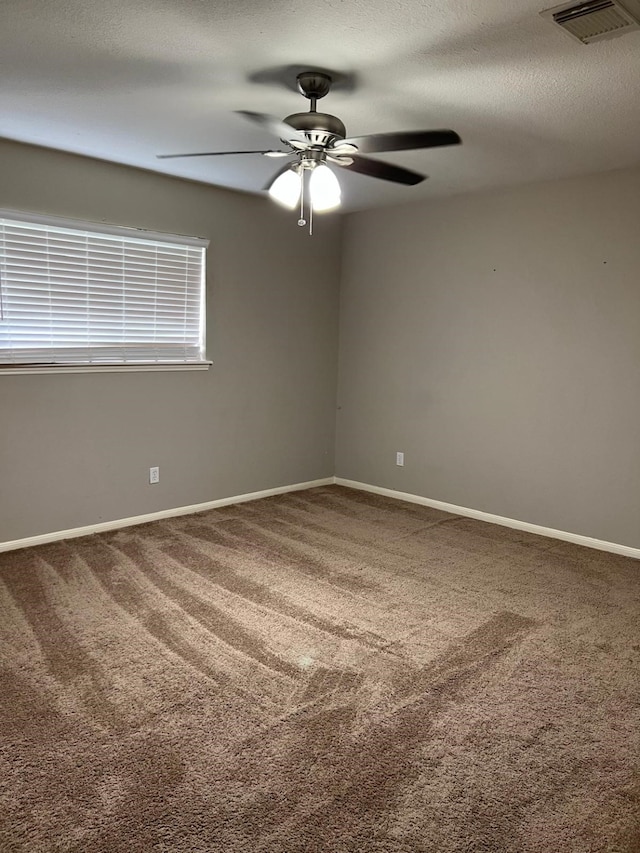 1506 Grand Valley Dr, Houston, TX 77090 - empty room featuring carpet floors, a ceiling fan, and baseboards