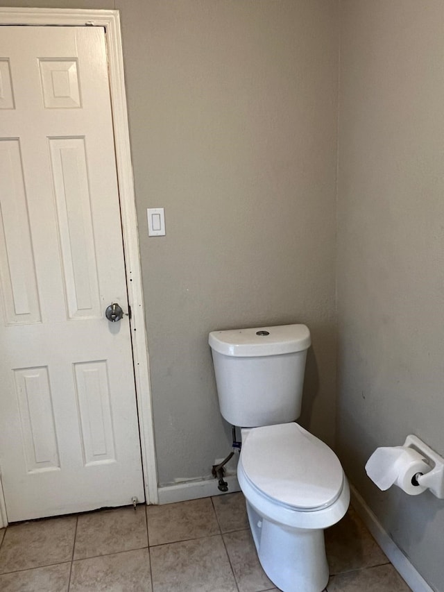1506 Grand Valley Dr, Houston, TX 77090 - bathroom featuring tile patterned floors, toilet, and baseboards