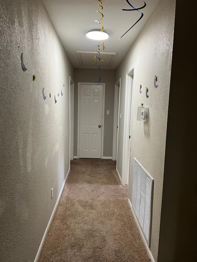 1506 Grand Valley Dr, Houston, TX 77090 - corridor featuring attic access, a textured wall, and carpet