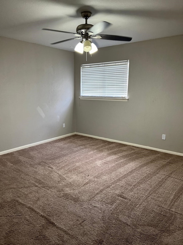 1506 Grand Valley Dr, Houston, TX 77090 - spare room featuring ceiling fan, carpet floors, and baseboards